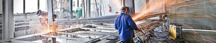 factory of prefabricated buildings : welding of the steel frames